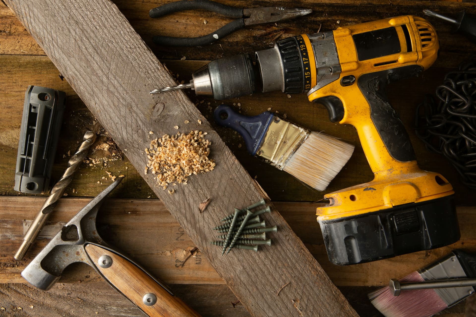 Wood construction materials and boards stored side by side, used as material supply context imagery.