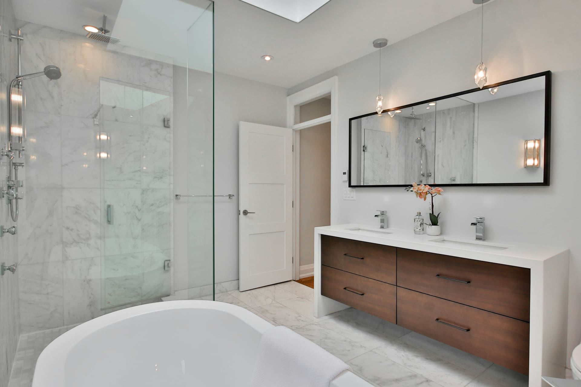 Modern bathroom fixtures and fittings in a plain interior, used as specification context imagery.