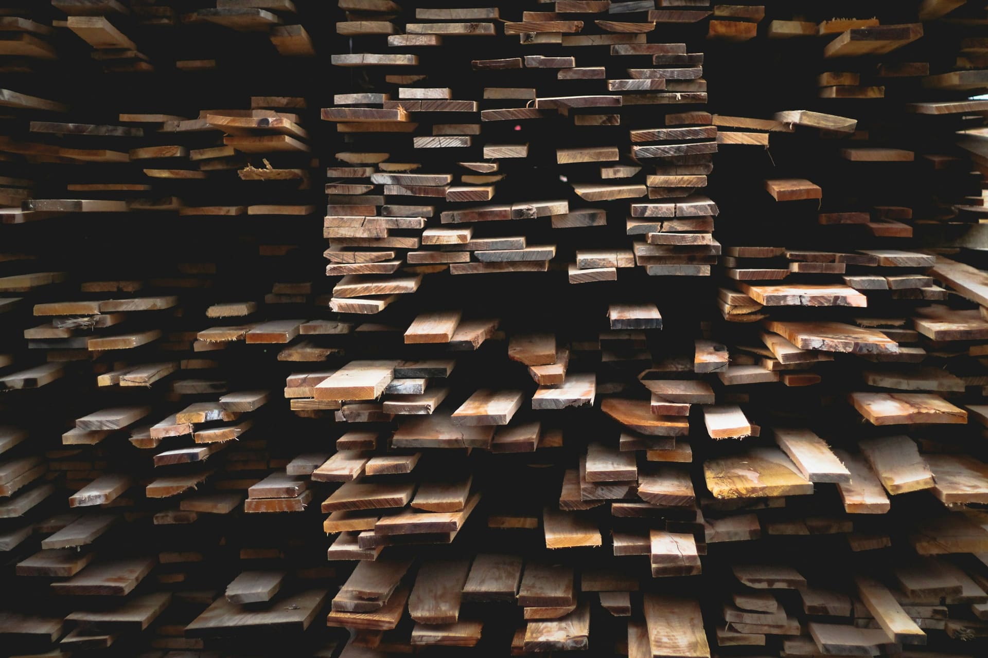 Neatly stacked sawn timber sections, used as context imagery for wholesale wood and timber supply.