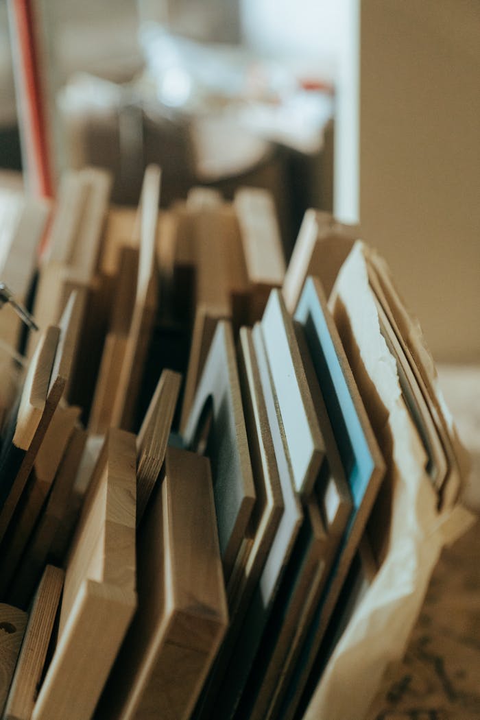 services-img Close-up of assorted wooden planks arranged in a workshop setting.